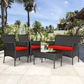 Ensemble de canapé de patio en rotin rembourré 4 pièces avec table basse en verre trempé - 24 x 23,5 x 33 (L x l x H)