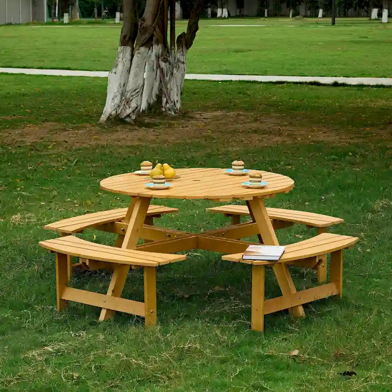 Table de pique-nique ronde d'extérieur pour 8 personnes avec 4 bancs intégrés et trou pour parasol.